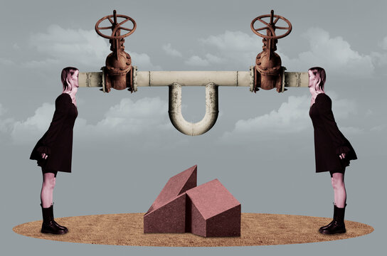 Two women with faces inside a pipe