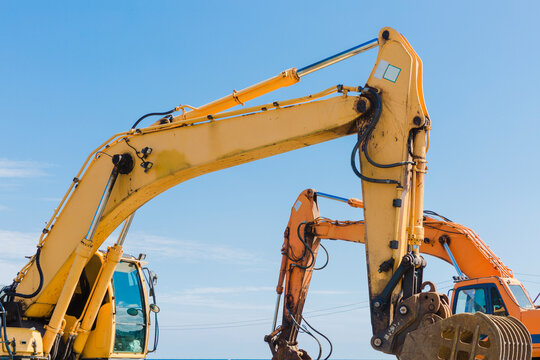 Yellow and orange excavator.