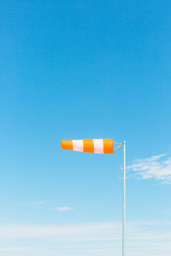 Sunny sky and wind direction flag.