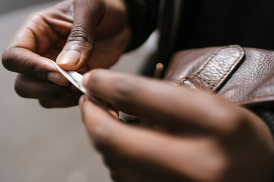Anonymous Man is Rolling a Cigarette 