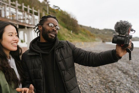 Young Couple of Content Creators Vlogging Outdoor