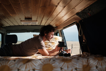 Photographer man taking Polaroid snapshots