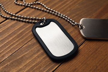 Fototapeta premium Military dog tags on wooden background
