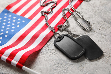 Military tags and flag of USA on light background