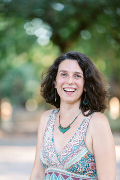 Elegant woman very happy at park in summer