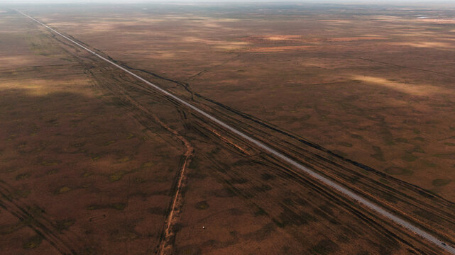 Aerial view of a lonely road in steppe of Kalmykia

