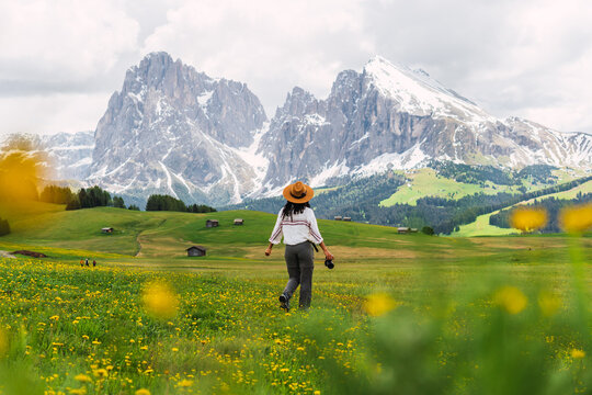 Young girl alone in Dolomites.