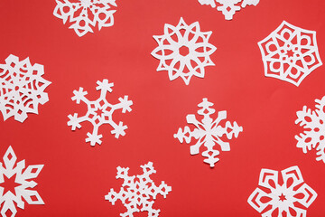 Naklejka na ściany i meble Beautiful paper snowflakes on red background