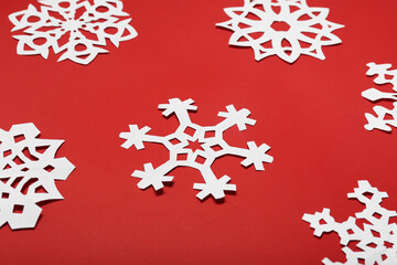 Beautiful paper snowflakes on red background