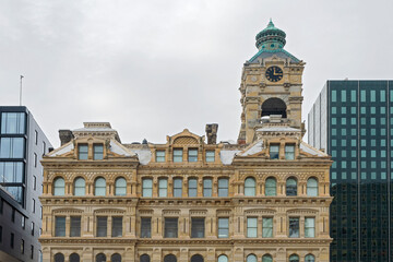facade and tower of historic victorian style building in milwaukee