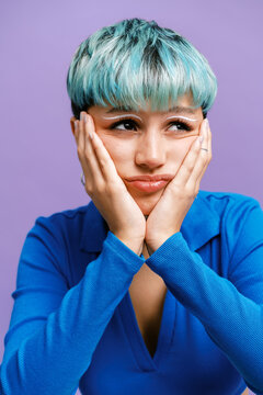 Young female model touching face