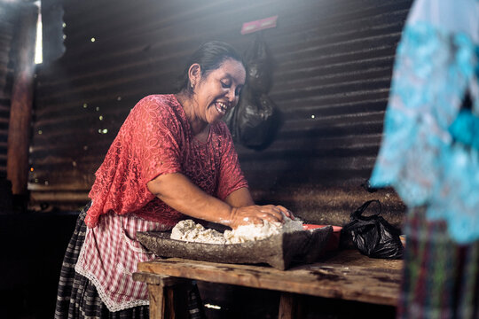 Mature guatemalan woman preparing creole food