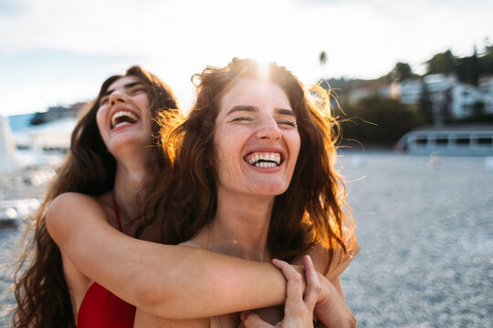 Sisters Laughing at Beach