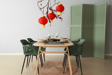 Beautiful table setting for Chinese New Year celebration in room