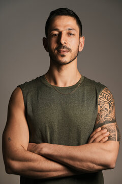 Confident adult man looking at camera