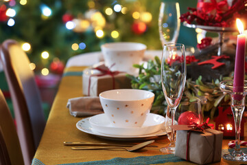 Dining table with setting for Christmas celebration indoors