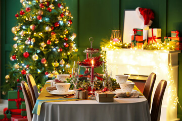 Dining table with beautiful setting in living room decorated for Christmas eve