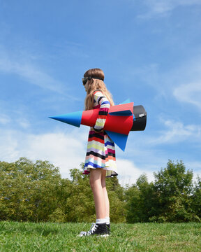 Girl Holding Paper Rocket 