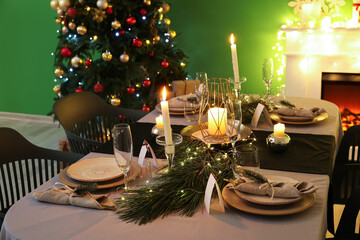 Dining table with beautiful setting in living room decorated for Christmas eve