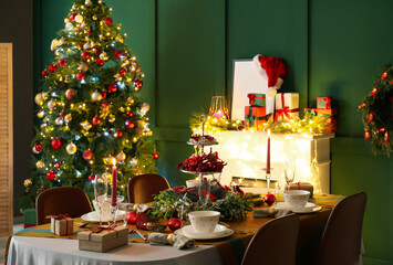 Dining table with beautiful setting in living room decorated for Christmas eve