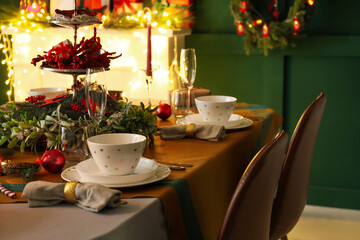 Dining table with setting for Christmas celebration indoors