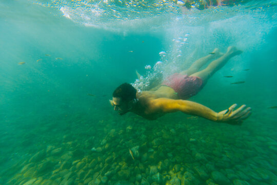 Young man diving 