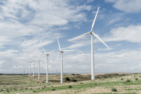 Eolic windmills on field