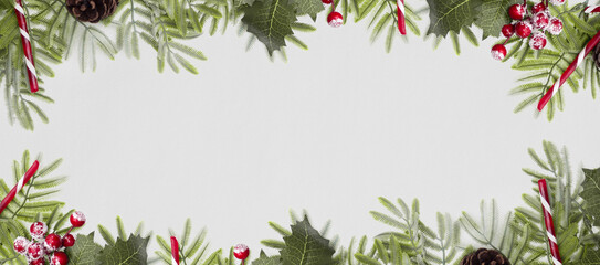Fototapeta na wymiar beautiful background with leaves, branches and candy cane, christmas day decorative