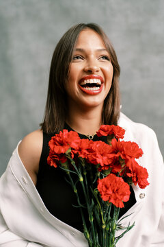 Happy female model with flowers