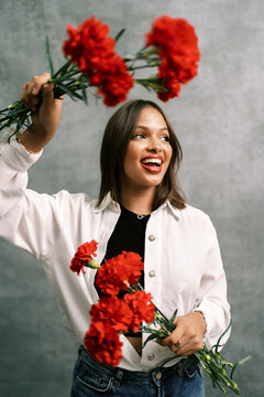 Happy female model with flowers