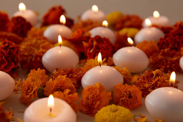 Selective focus of candles and flowers