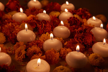 Candles and flowers in dark