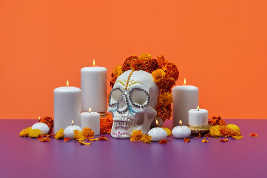 Still life with skull in wreath and candles