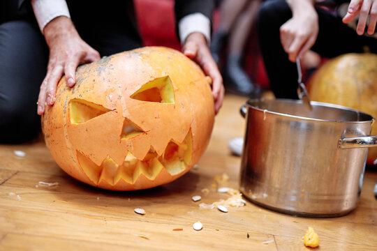 Unrecognizable people preparing to Halloween party 