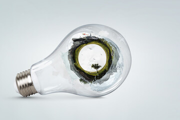 Green landscape inside light bulb