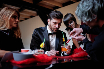 Guests invited on Halloween tasting different drinks