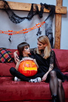 Mother and son together celebrating Halloween at home