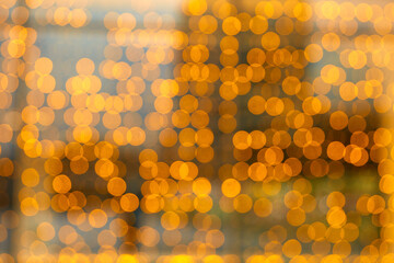 Christmas and New Year holidays and decorations. Blurred background with bokeh, lights, illumination. New Year, festive, winter background. Night city