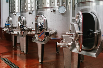 Metal tanks at brewery factory