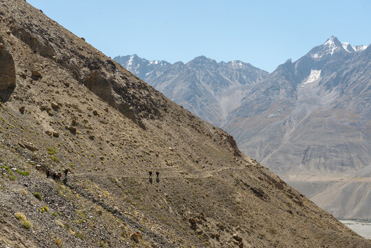 Porters on steep trail