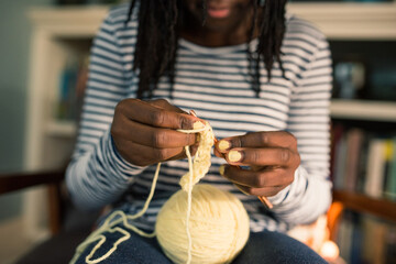 Black girl's hands crocheting