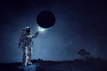 Astronaut walking on an unexplored planet