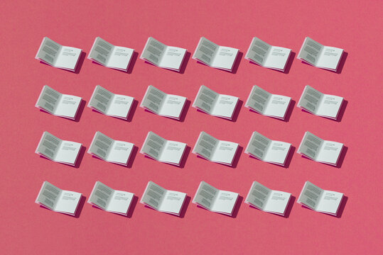 The books pattern seamless on pink background.