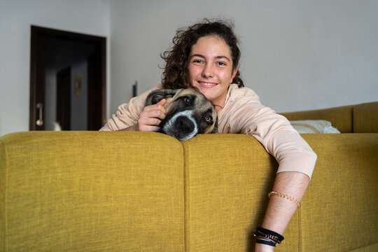 Happy teenager with dog portrait