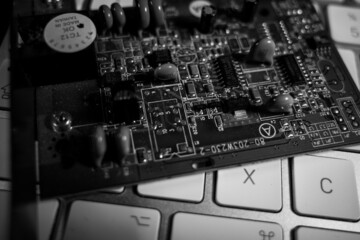  computer board lies on a white keyboard