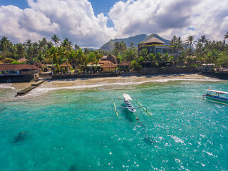 Fototapeta na wymiar An aerial panoramic view on Candi Dasa shoreline on Bali island in Indonesia