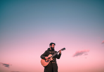 Enjoying guitar sound during sunset