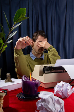Anonymous man behind a typewriter