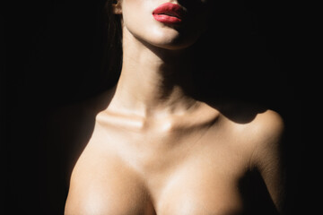 Sexy lips and tits boobs, breast. Beautiful young woman portrait on black. Sensual face of elegant...