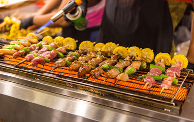 Barbeque grill at food market in Thailand, Assorted delicious grilled meat with vegetables 